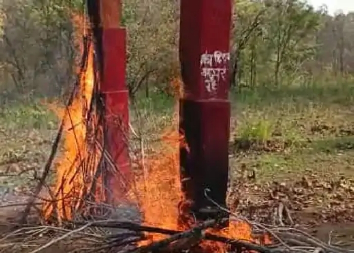 burn naxalites wooden memorial